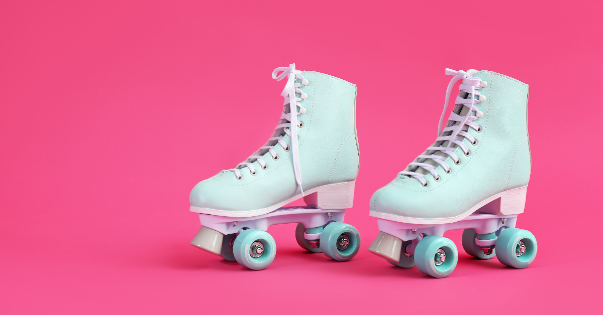 Two blue skates on a pink background